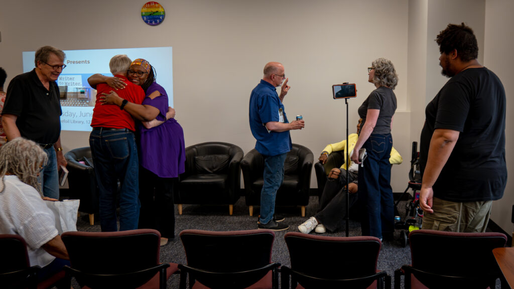 A photo of panelists and attendees at the Writer to Writer: Queer Voices, Curators Past & Present event